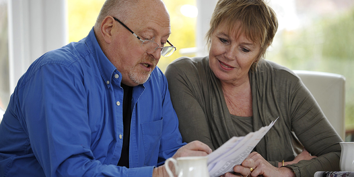 Lady and Gentleman reading some paperwork
